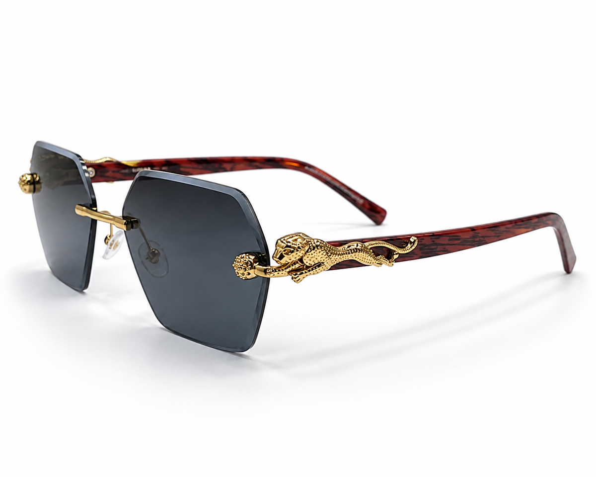 Sunglasses with gold accents and tortoiseshell frame on a white background