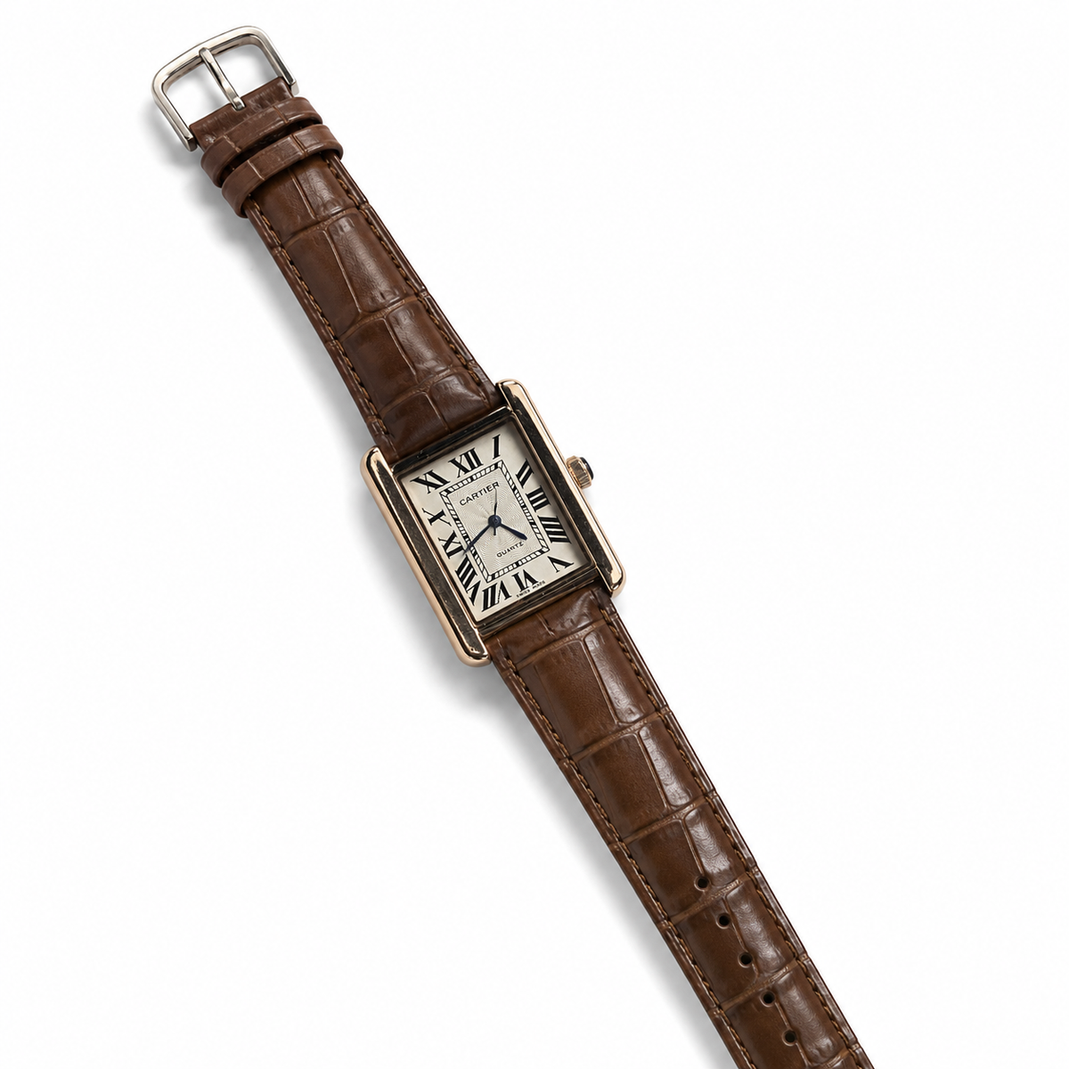 Watch with brown leather strap and gold case on white background