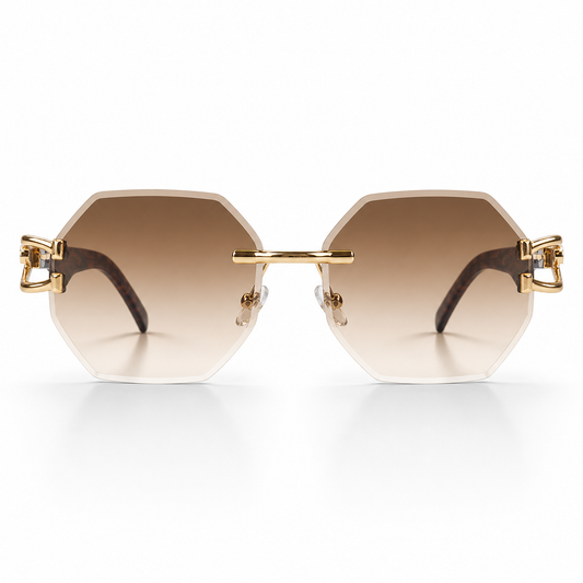 Gold-framed sunglasses with brown gradient lenses on a white background
