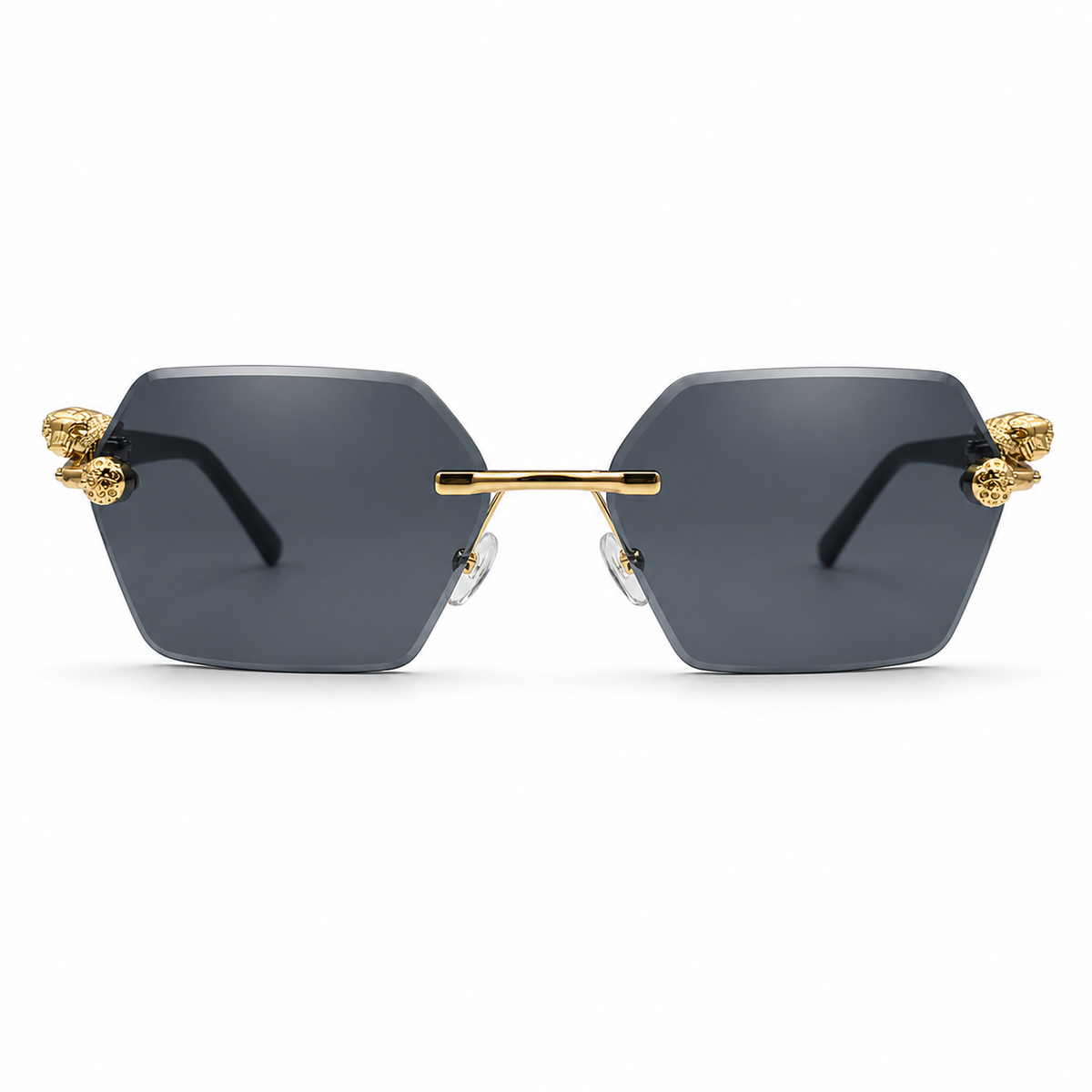 Sunglasses with gold accents and dark lenses on a white background