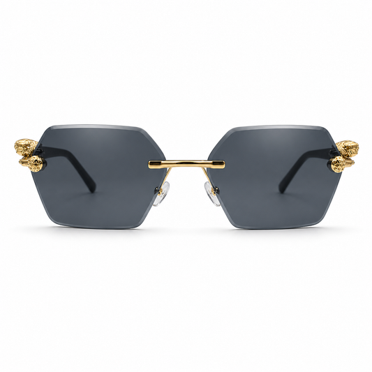 Sunglasses with gold accents and dark lenses on a white background