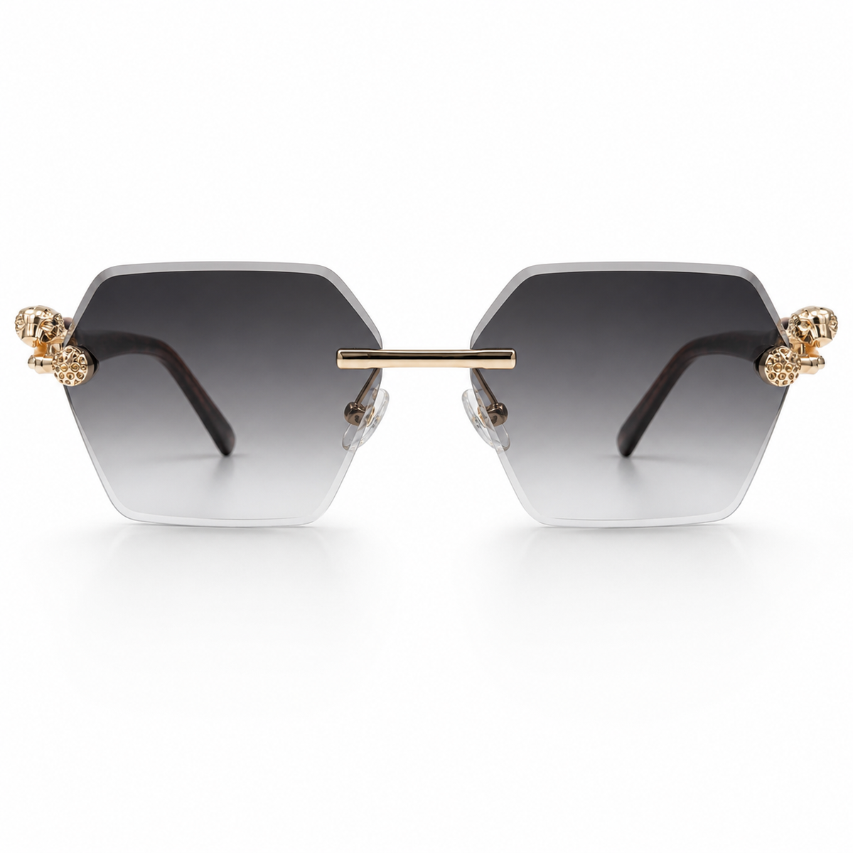 Sunglasses with gold accents and gradient lenses on a white background