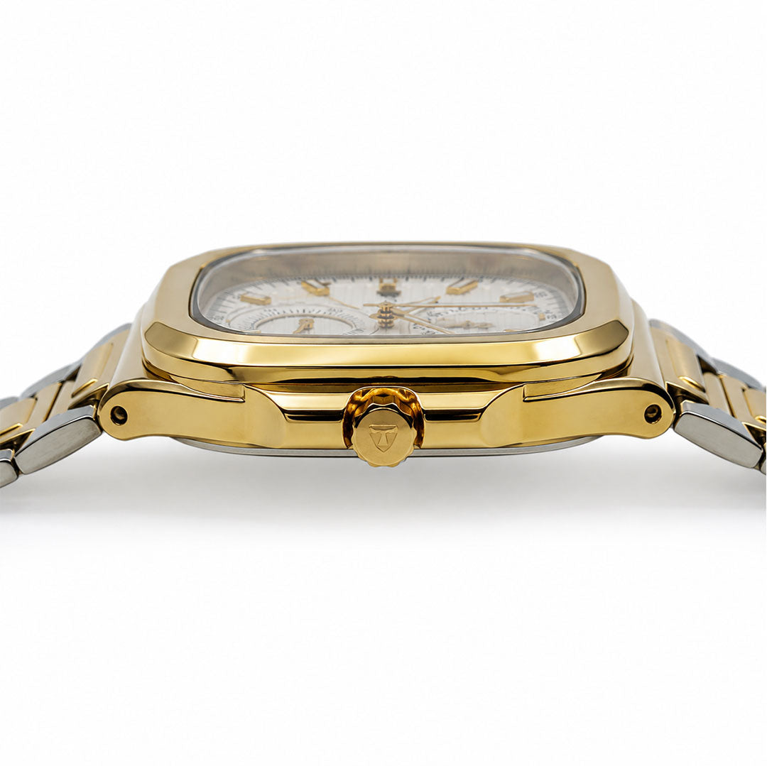 Gold wristwatch with a white face on a white background
